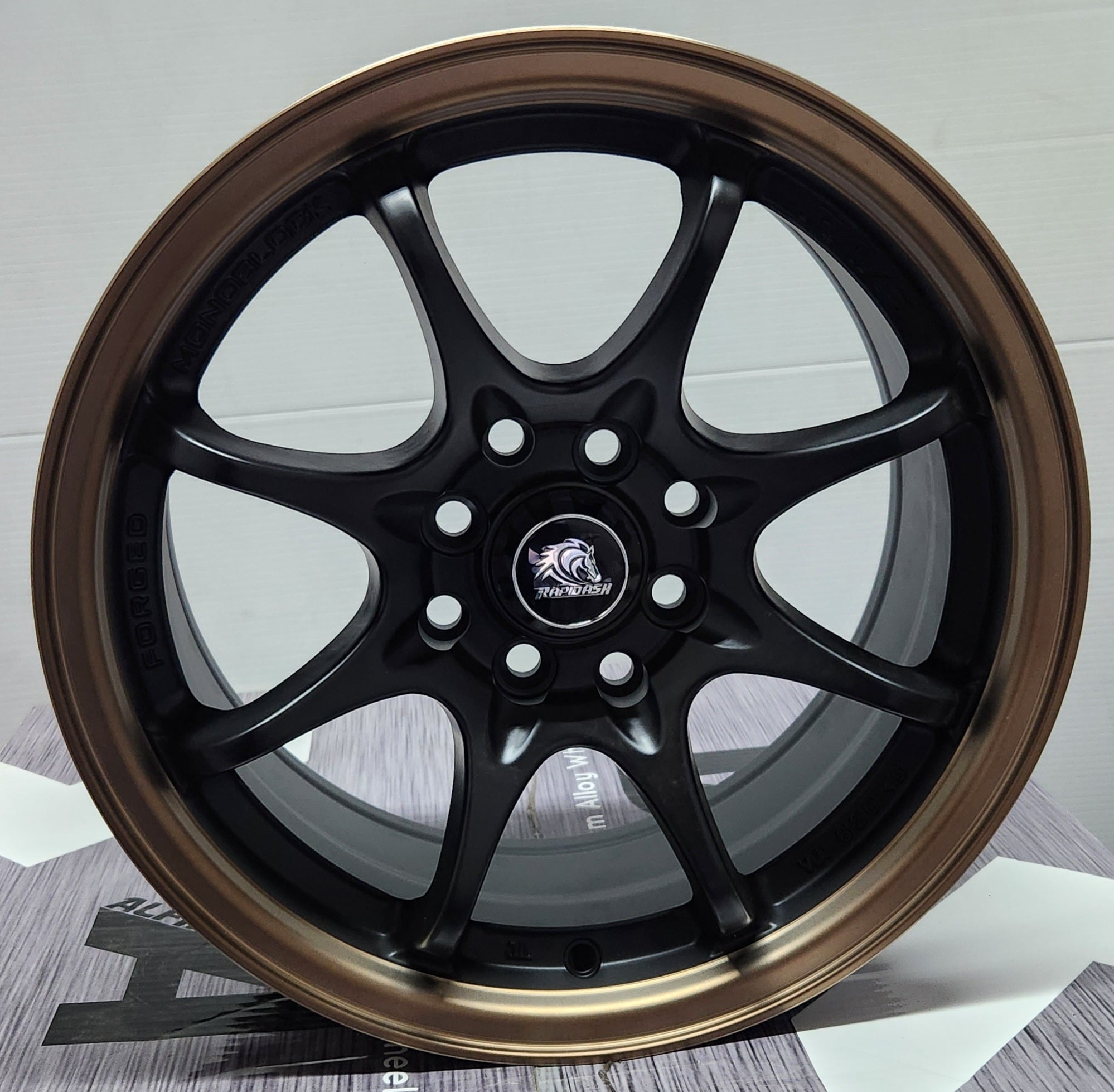 NS - 029 15x7.0 4x100 / 4x114.3 MATTE BLACK BRONZE LIP - Gun Hill Tire House (WTW - WHOLESALE TIRES & WHEELS)