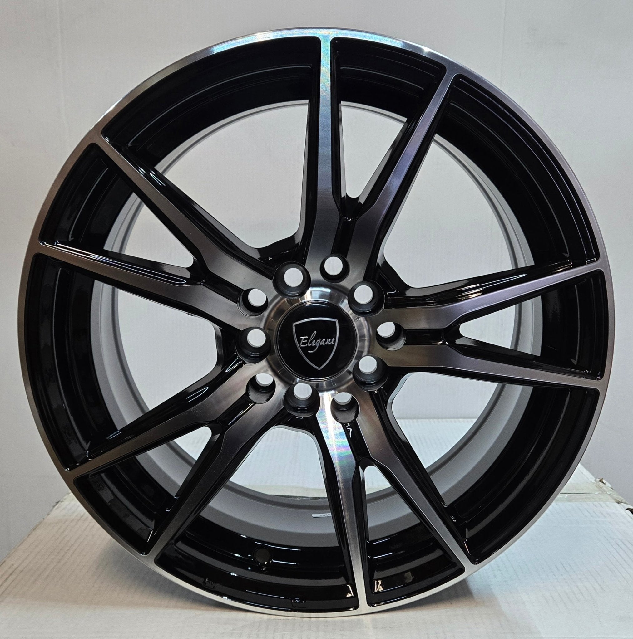 5457 ELEGANT E - 001 16X7.0 5X100 5X114.3 PIANO BLACK MACHINE - Gun Hill Tire House (WTW - WHOLESALE TIRES & WHEELS)